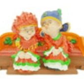 Happy Couple on Orange Matrimonial Chair