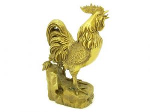 The brass Rooster is depicted with a well-shaped beak and eyes on full alert.