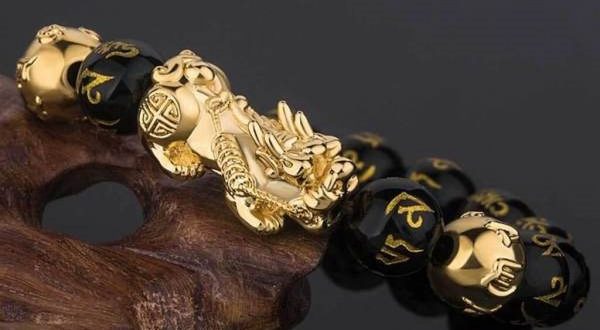 This Bracelet is made of 18K Gold plated Pixiu, authentic black obsidian, and OM symbol beads arranged in the count of 8 beads.