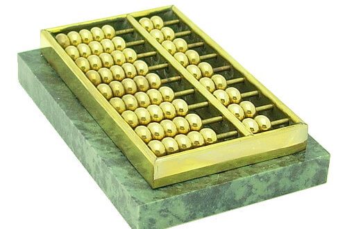 This abacus is made of high-quality brass adhered to a heavy rectangular marble piece.